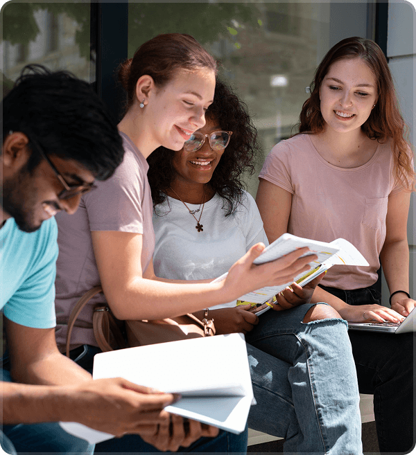 Group of diverse young adults studying together and sharing ideas in wellness community